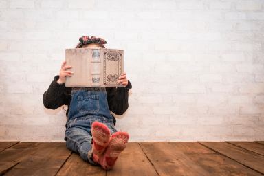 Little girl reading a book