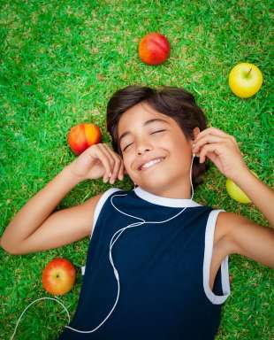 Happy boy listening to music