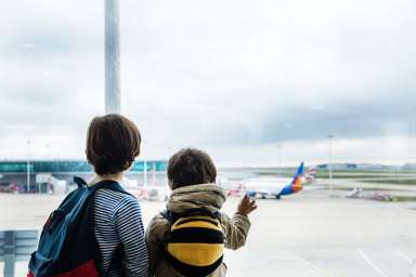 Brothers in airport departure lounge