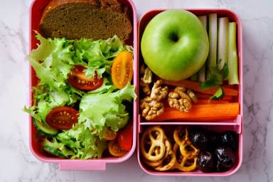 Lunch box with salad and healthy food for work and school