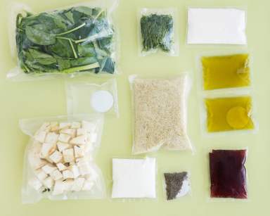 set of products for a vegetarian dinner: rice, spinach, celery, dill, Olive oil, sauces and spices. Set for delivery of food for dinner on a light background. Cooking at home, home cooking.